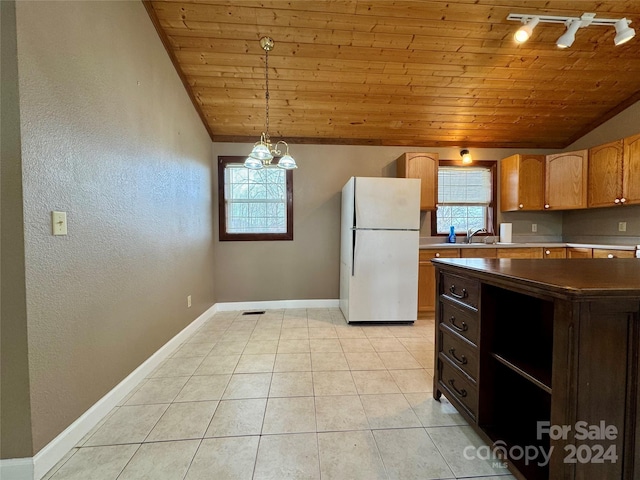 kitchen featuring hanging light fixtures, wooden ceiling, an inviting chandelier, white refrigerator, and light tile patterned floors