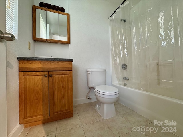 full bathroom featuring toilet, shower / tub combo, vanity, and tile patterned floors