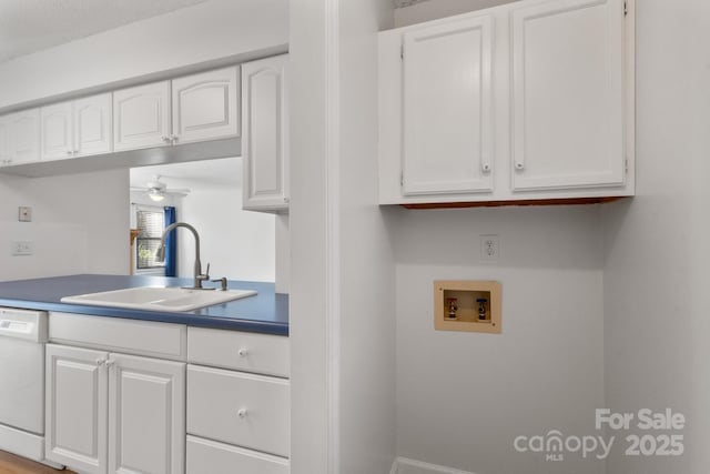 laundry room with hookup for a washing machine, ceiling fan, and sink