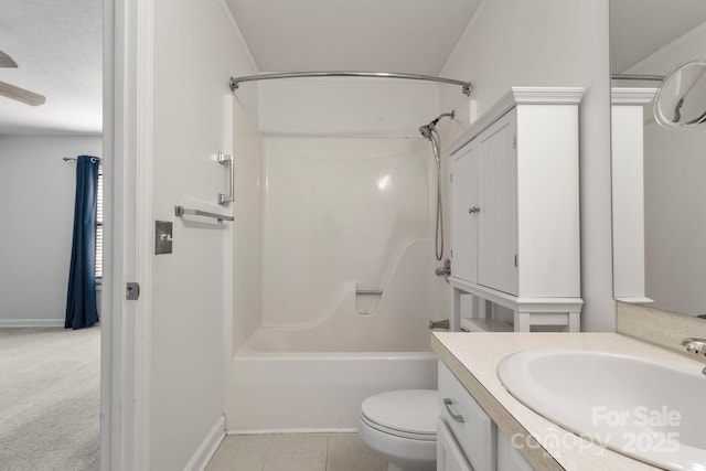 full bathroom with bathing tub / shower combination, vanity, a textured ceiling, and toilet