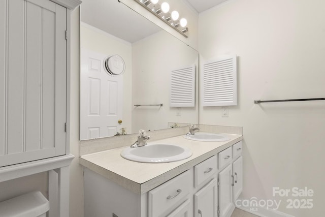 bathroom featuring vanity and crown molding