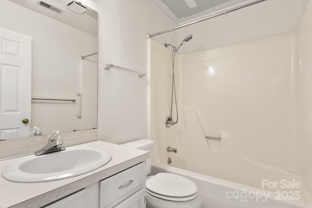 full bathroom featuring vanity, tub / shower combination, and toilet