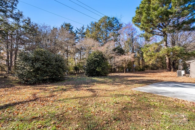 view of yard with central AC