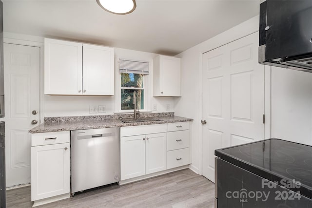 kitchen featuring dishwasher, white cabinets, sink, range with electric stovetop, and light wood-type flooring