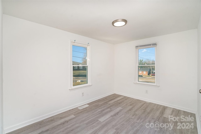 spare room featuring light hardwood / wood-style flooring