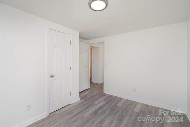 empty room with light hardwood / wood-style floors