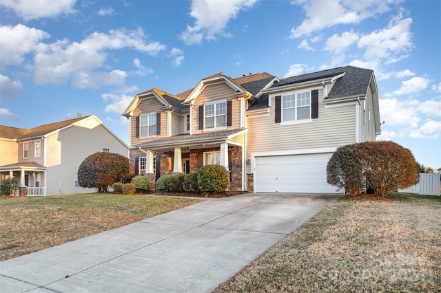 view of front of property featuring a garage and a front yard