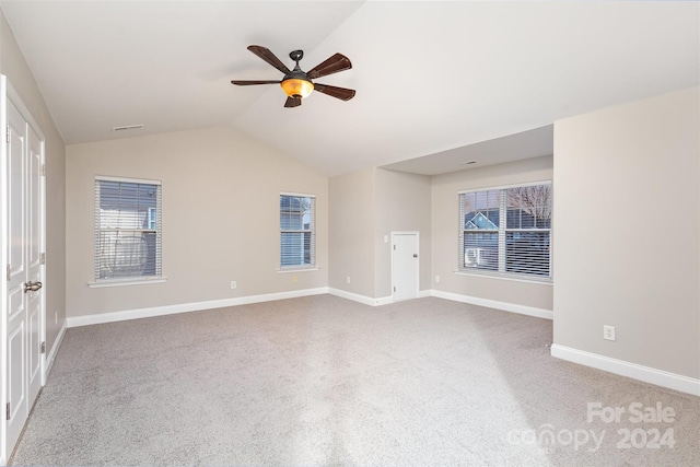 unfurnished room featuring ceiling fan and lofted ceiling