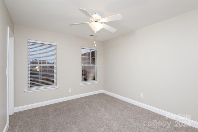 carpeted empty room with ceiling fan