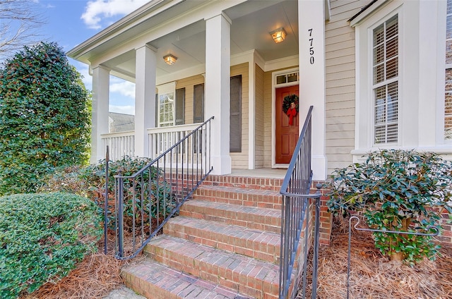 entrance to property featuring covered porch