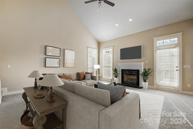 living room with light carpet, high vaulted ceiling, and ceiling fan