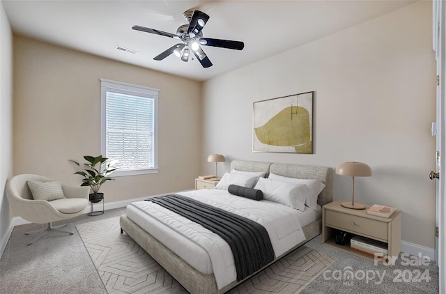 carpeted bedroom featuring ceiling fan