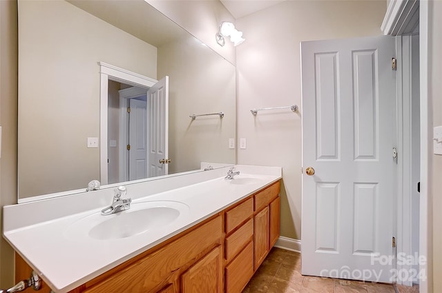 bathroom featuring tile patterned floors and vanity