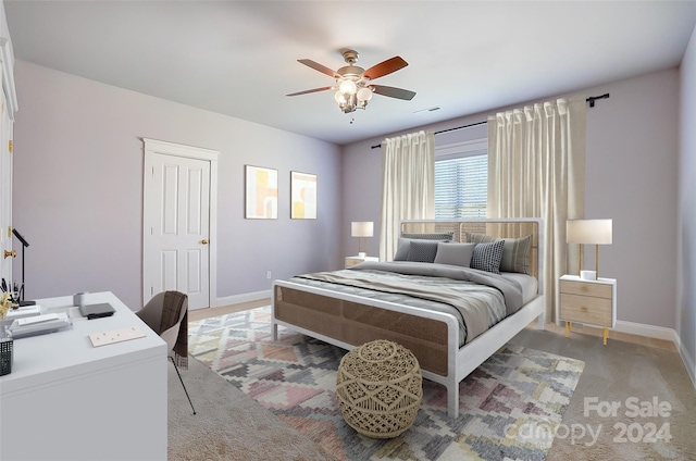 carpeted bedroom featuring ceiling fan