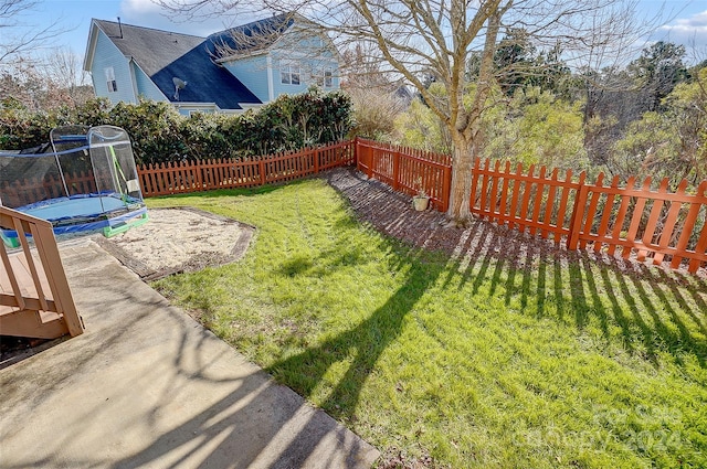 view of yard featuring a trampoline