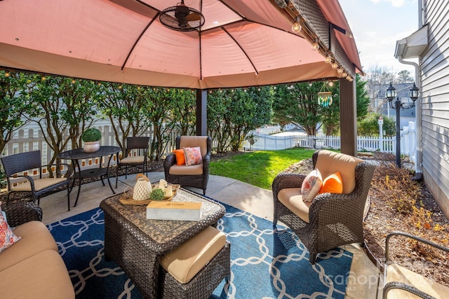 view of patio with outdoor lounge area and a gazebo