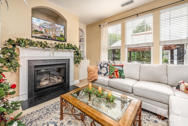 living room featuring built in features