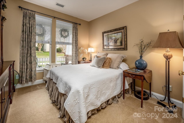 bedroom with light carpet