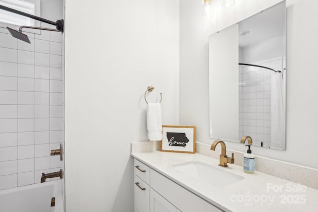 bathroom with vanity and tiled shower / bath combo