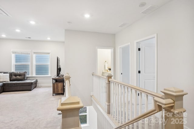 hallway with carpet floors