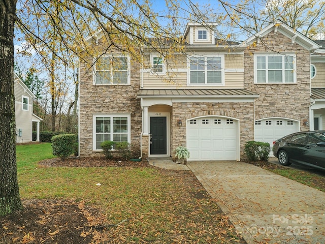 view of front of house with a front yard and a garage