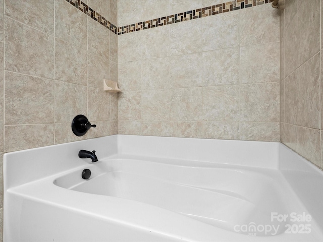 bathroom with a tub