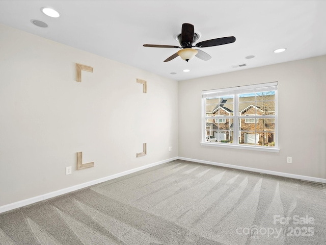 carpeted empty room with ceiling fan