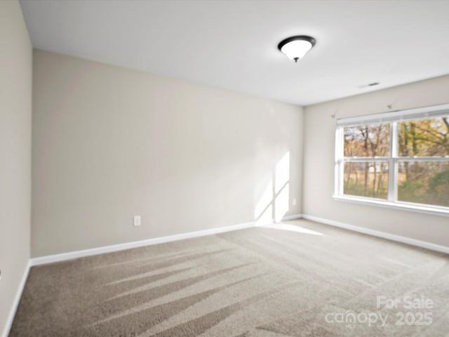 view of carpeted spare room