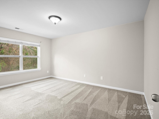 unfurnished room with carpet floors