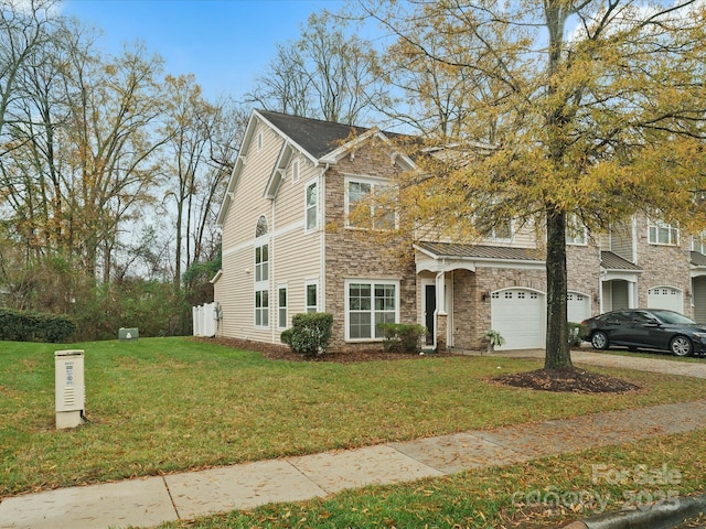 view of front of home featuring a front lawn and a garage