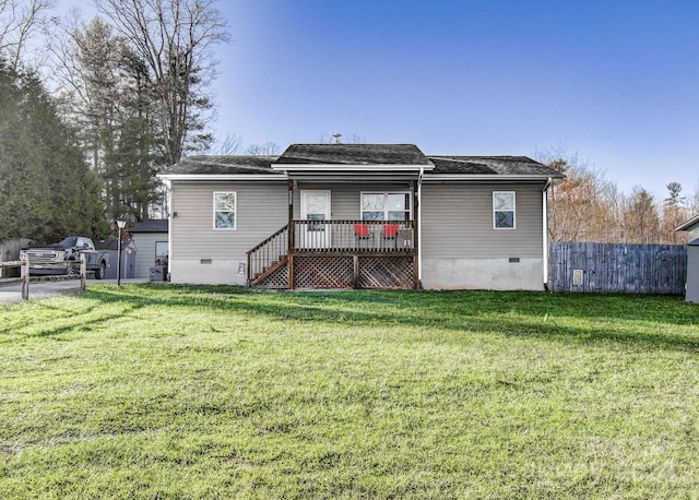 back of house featuring central AC and a lawn