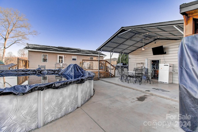 view of patio with a pool side deck