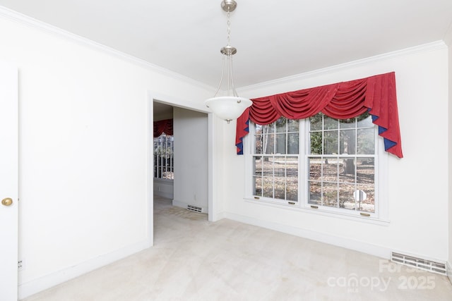 unfurnished dining area with carpet floors and ornamental molding