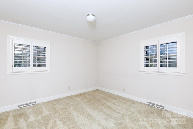 unfurnished room with carpet flooring and crown molding