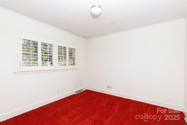 carpeted spare room with ornamental molding