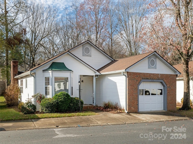 single story home featuring a garage