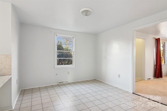 view of tiled spare room