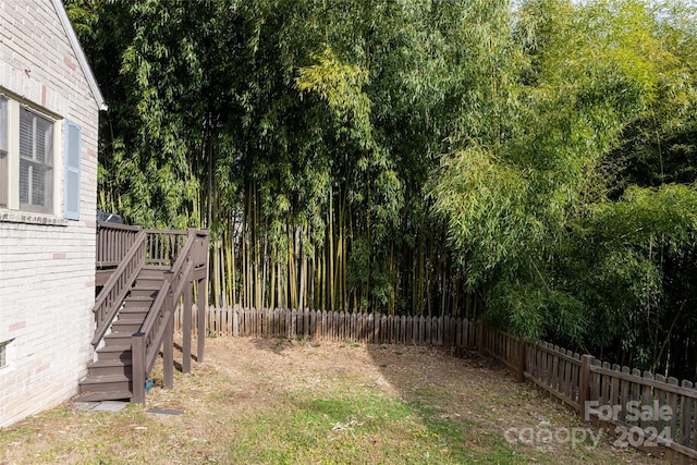 view of yard with a wooden deck