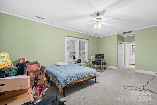 bedroom with ceiling fan, crown molding, and light colored carpet