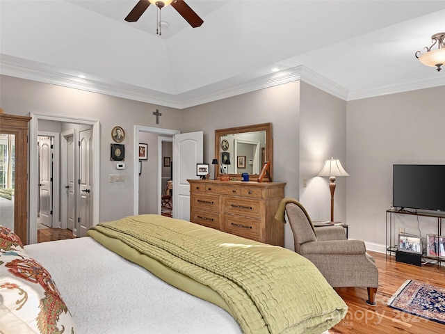 bedroom with ceiling fan, wood-type flooring, and ornamental molding