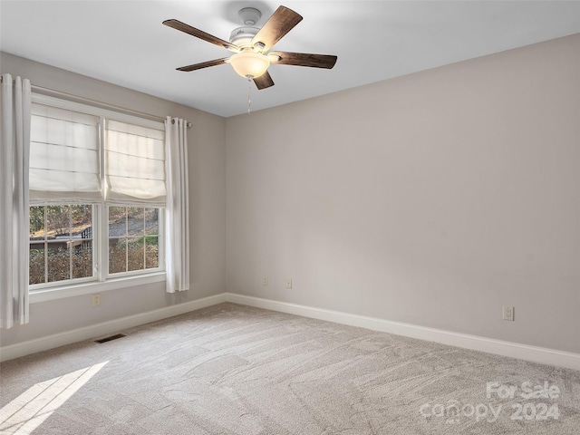 unfurnished room featuring carpet flooring and ceiling fan