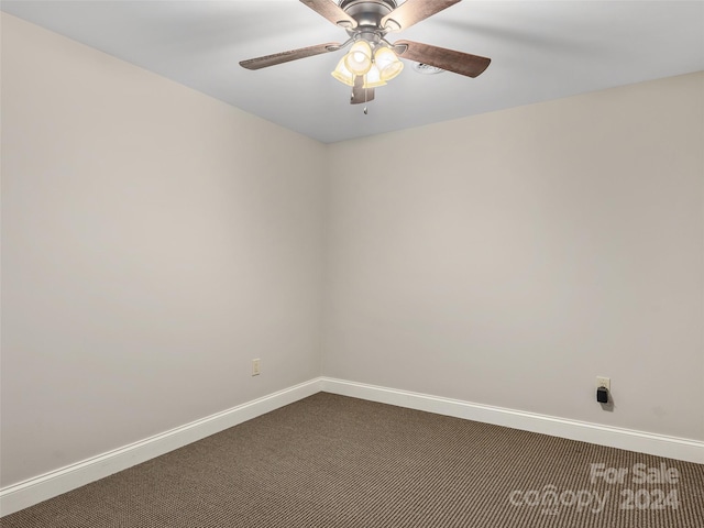 spare room featuring carpet flooring and ceiling fan