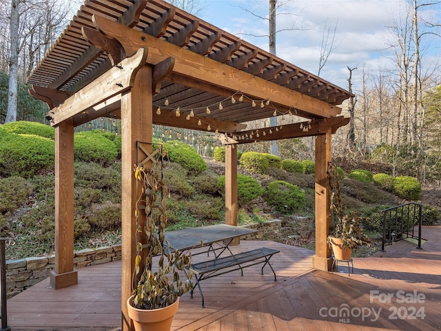 wooden deck featuring a pergola