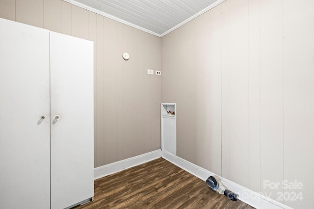 laundry room featuring washer hookup, wooden walls, dark hardwood / wood-style floors, and ornamental molding