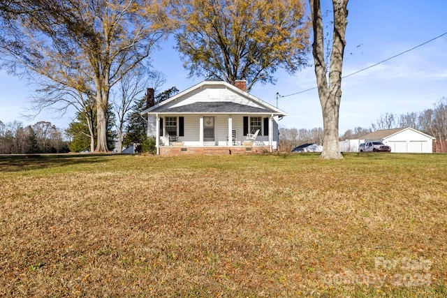 view of front facade with covered porch and a front yard