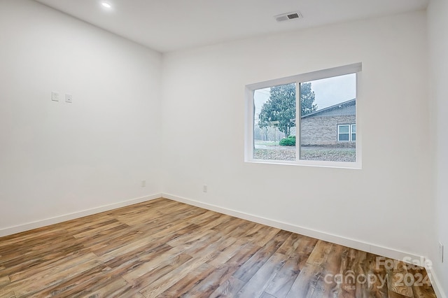 unfurnished room featuring light hardwood / wood-style floors