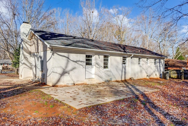 back of house featuring cooling unit