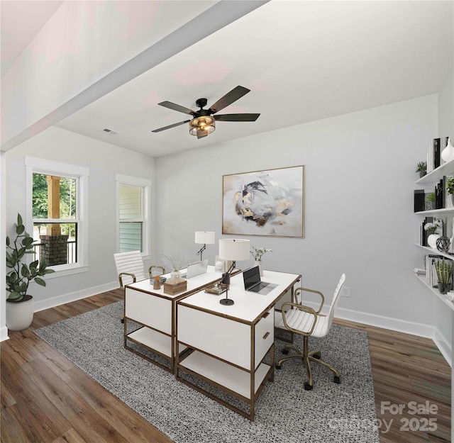 office space featuring dark hardwood / wood-style floors and ceiling fan