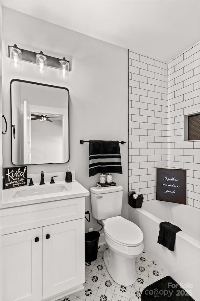 full bathroom with vanity, bathtub / shower combination, and toilet