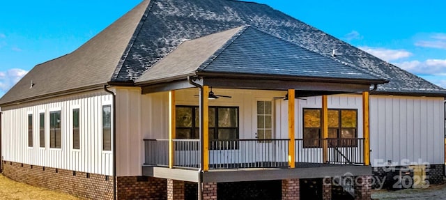 rear view of property featuring ceiling fan